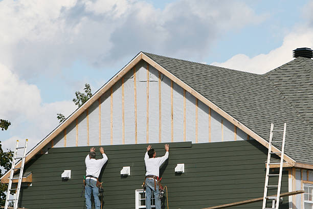 Professional Storm Damage Siding Repair technician working in Houston, OH